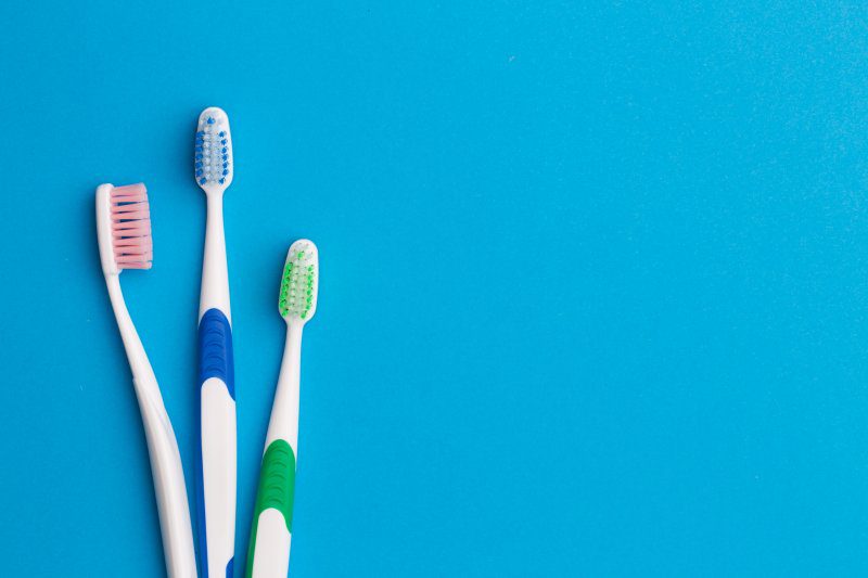toothbrushes on blue background