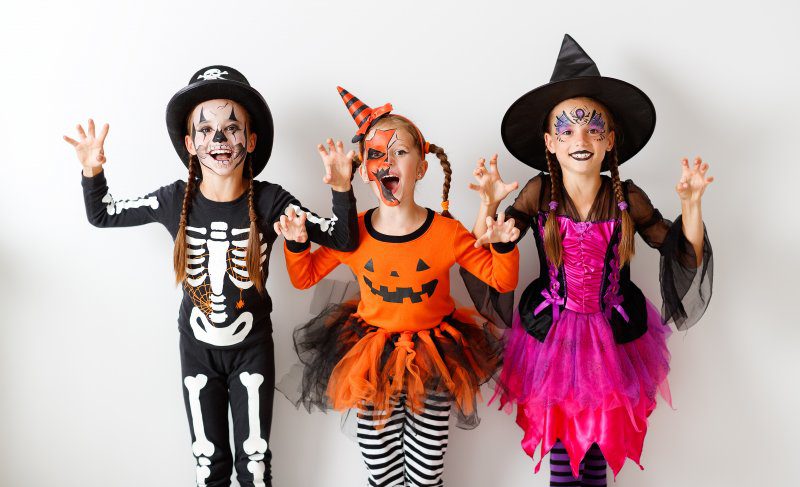 group of children in costumes on Halloween