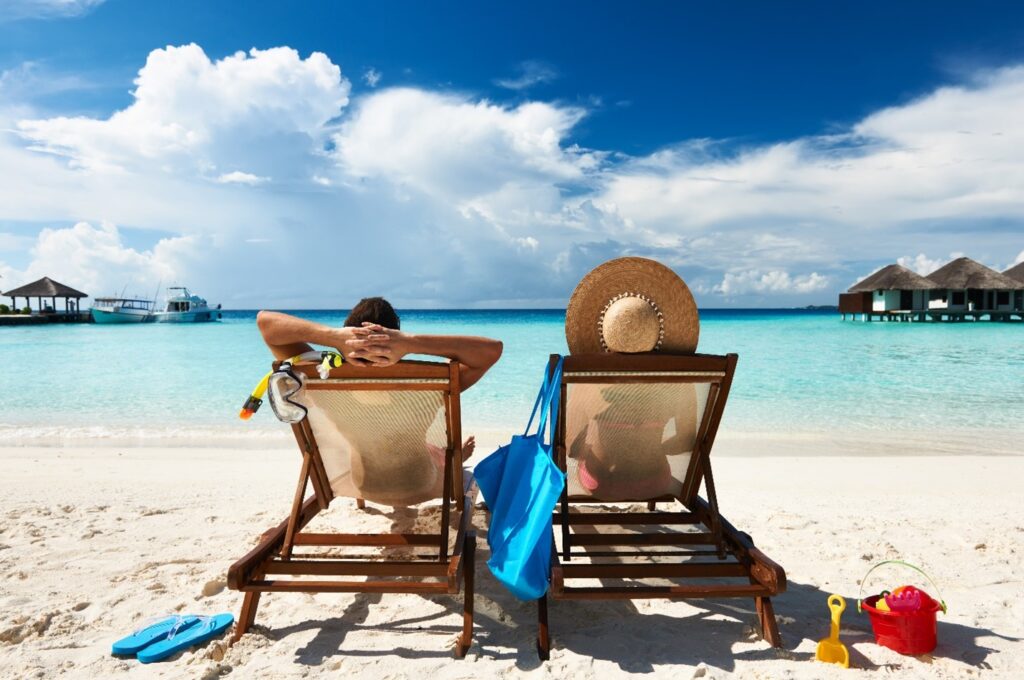 People relaxing on a beach during summer vacation.