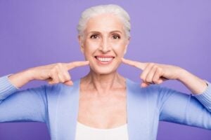 a person with dental implants smiling