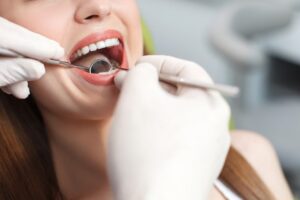 a patient visiting their dentist for an oral cancer screening 