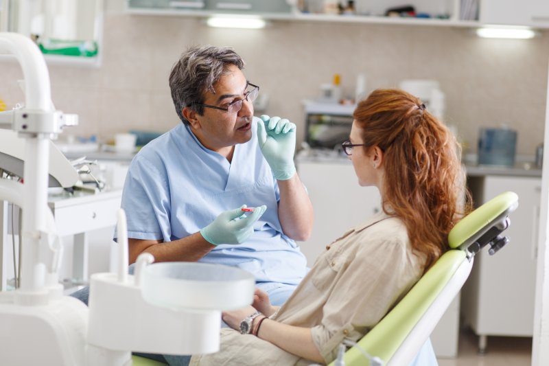 patient talking to the dentist
