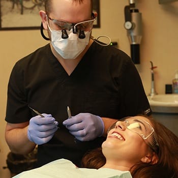 Dr. Ellis Shwarts communicating dental procedures with patient- Shwarts Family Dentistry