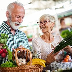 Smiling couple shopping for food