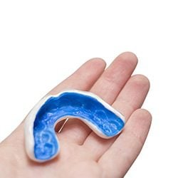 Mouth Guard in hand - Protect your teeth - Emergency Dentistry in Dallas, TX