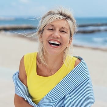 Woman smiling with beautiful Dental Implants - Dallas, TX