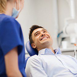 Dental professional explaining dental implants to a patient