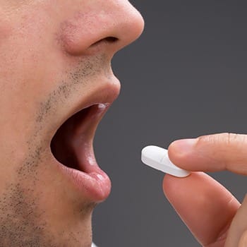 Man taking oral sedation