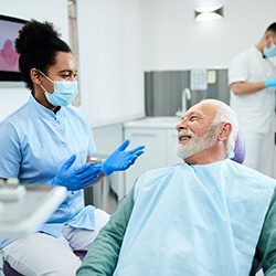 Dr consulting patient about cosmetic teeth whitening options