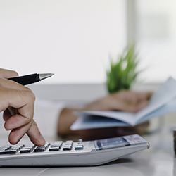 Man Calculating the cost of Cosmetic Dentistry Whitening procedure in Dallas, TX